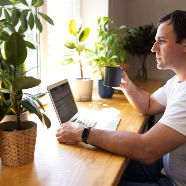 young-personal-development-coach-answering-the-client-by-email-by-a-laptop-2.jpg